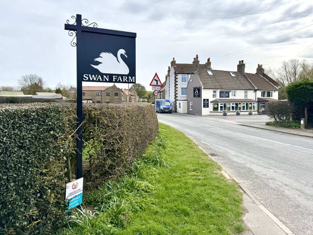 Swan Farm sign and Hare and Hounds pub in High Hawsker on the Robin Hood's Bay walk.