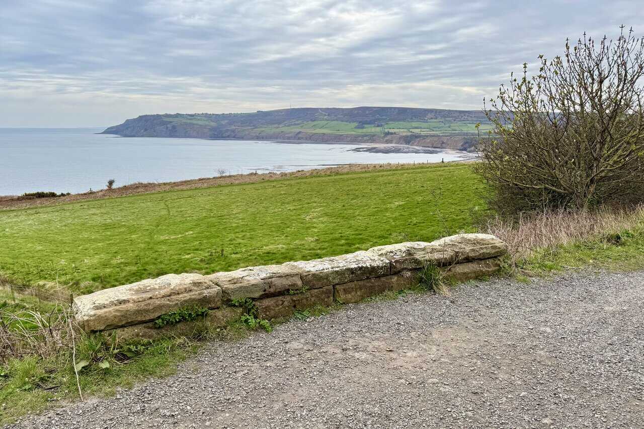 Stone bridge on the Cinder Track with sweeping coastal views on the Robin Hood's Bay walk.