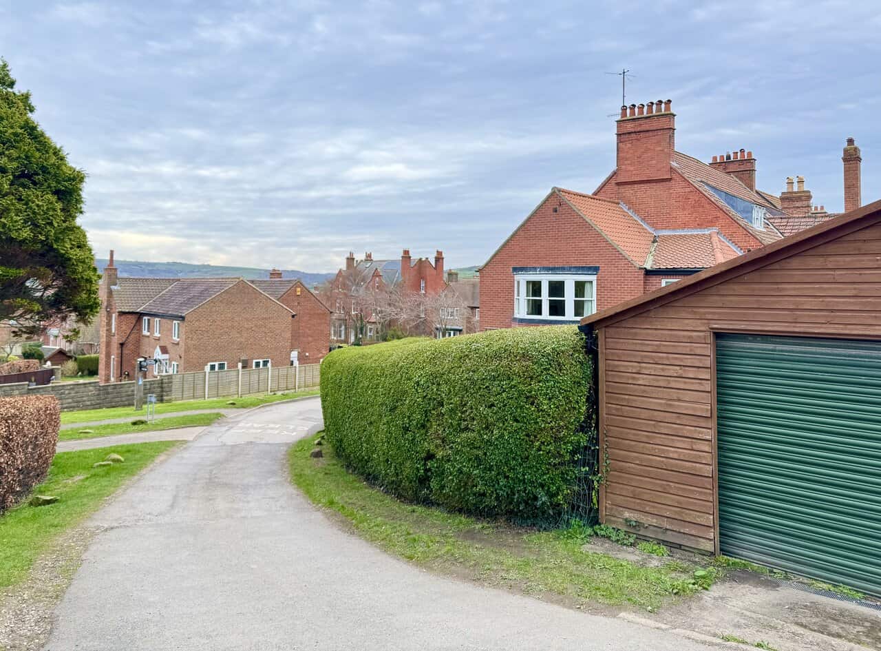 Return into the village along hedges and red-brick houses near the end of the route.