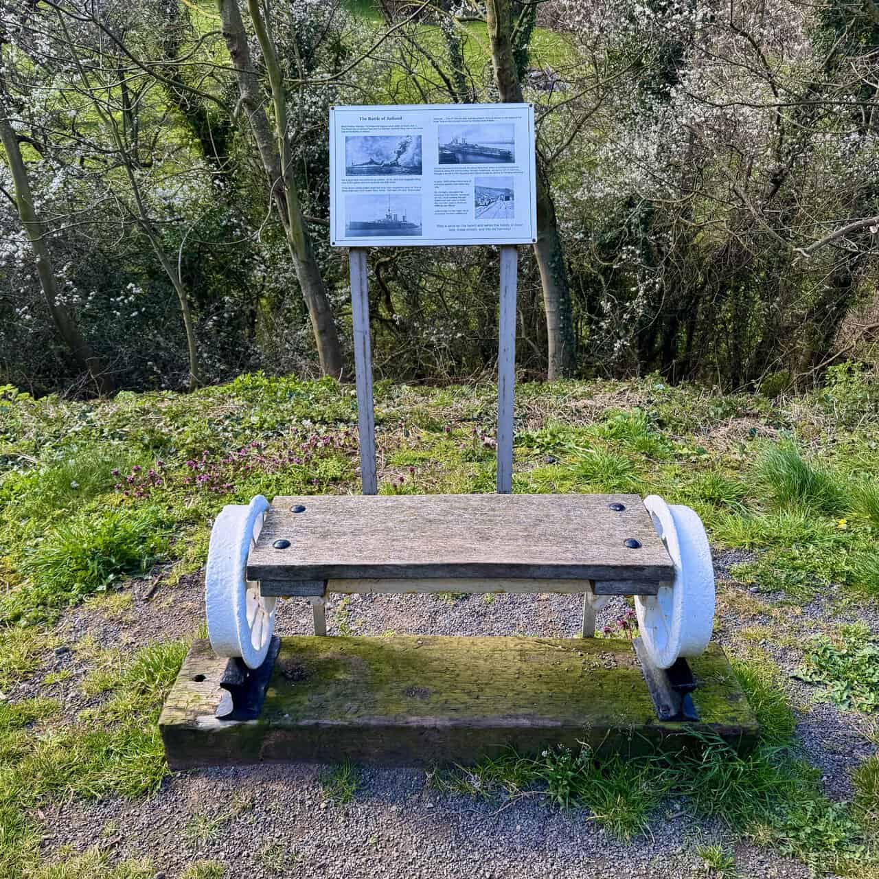 Former tramway path near Dalehouse, with a bench made from old railway parts beside an information board about Grinkle Ironstone Mine.