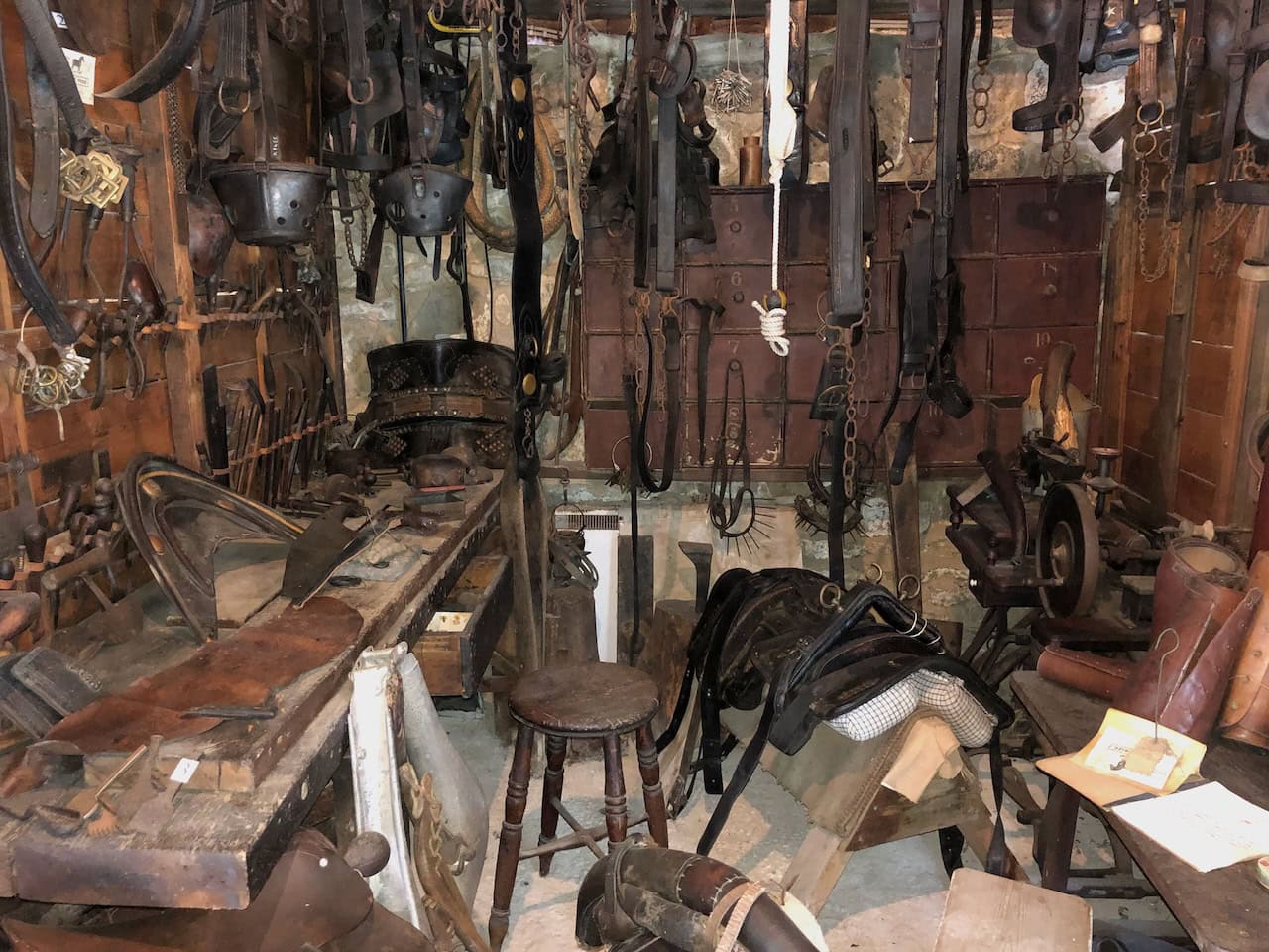 The Saddler's Shop, displaying the leather-working tools and specialist equipment used to produce harnesses and gear for the working horses and ponies that were essential to moorland farming and transport.