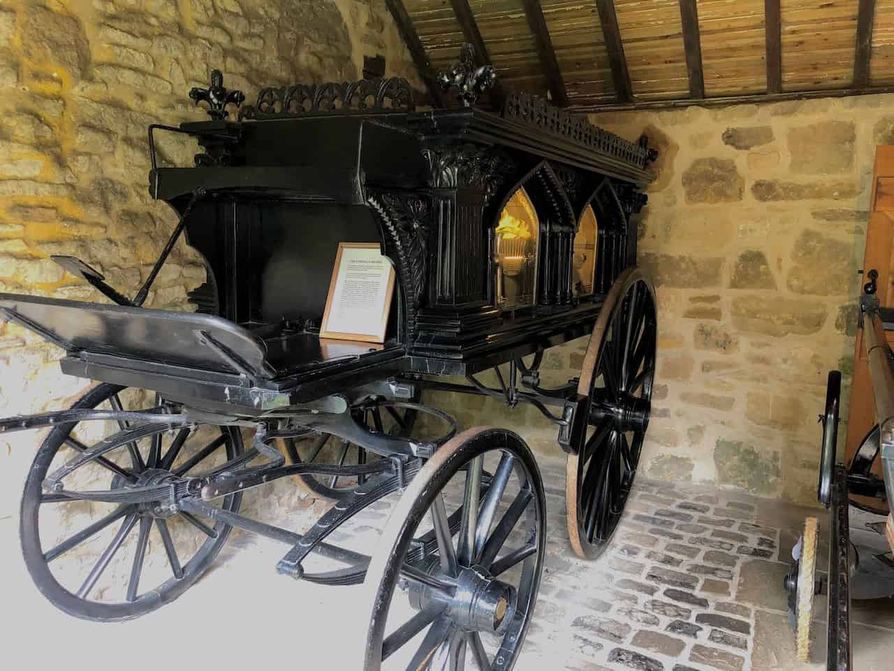 The Undertaker's Premises at Ryedale Folk Museum, housing funeral artefacts and elaborate 19th-century memorial cards, and home to the Farndale Hearse of 1839, bought collectively by the remote moorland community.