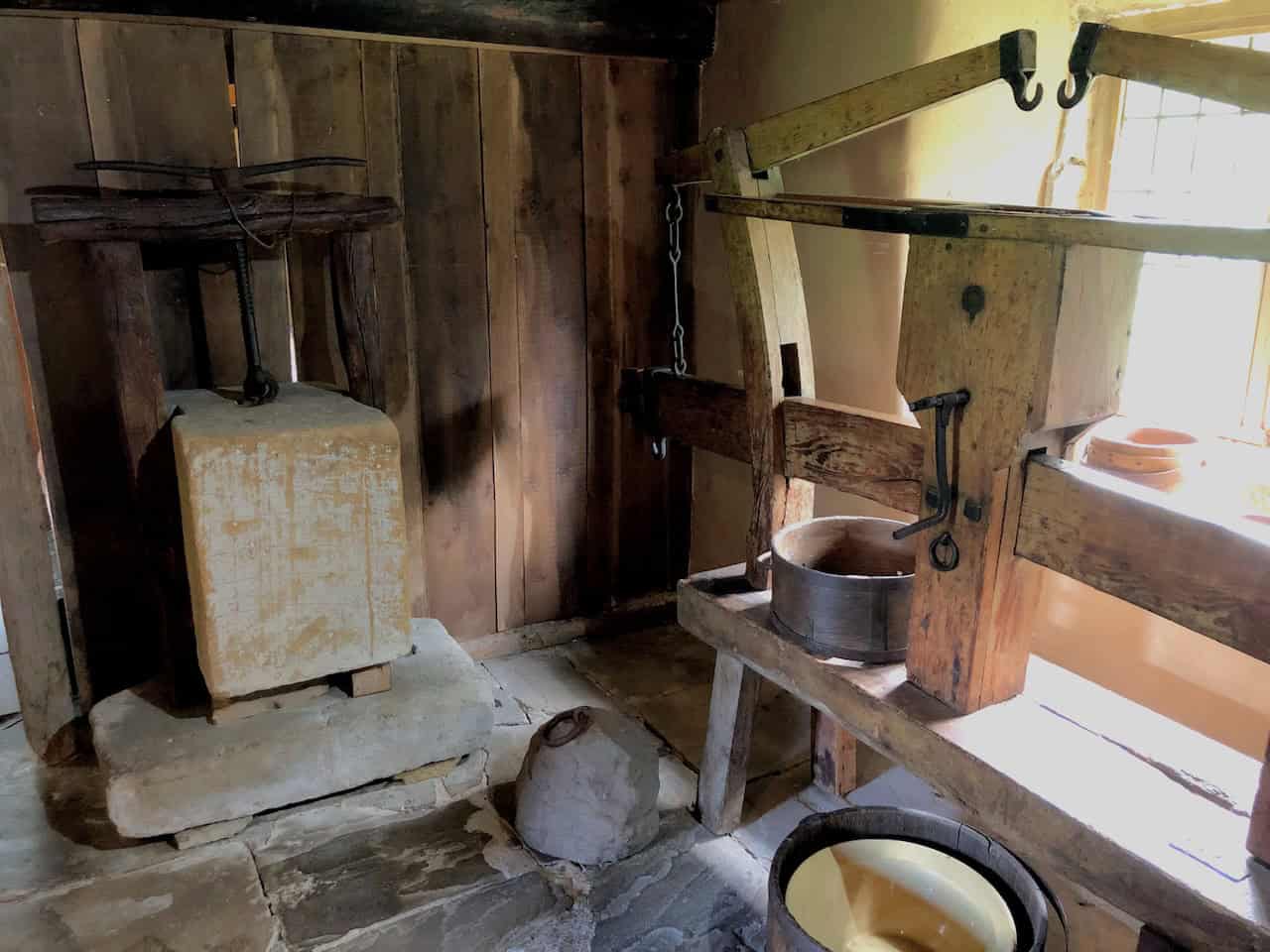 The rare witch post inside Stang End Cruck House at Ryedale Folk Museum, one of only twenty known to exist in the country, carved with a St Andrew's Cross and placed at the hearth to protect the home from evil influences.