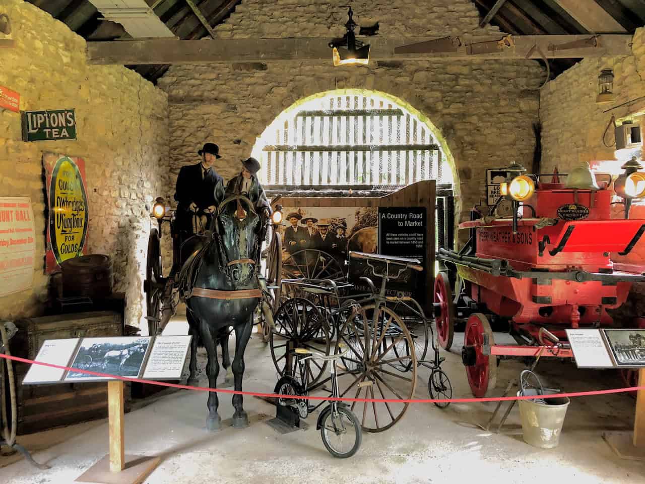 The High Barn, housing a collection of vehicles from between 1850 and 1950, including the Merryweather fire engine of around 1850, which required at least twelve strong people to operate: five on each side to pump, one to direct the water, and one to manage the supply.