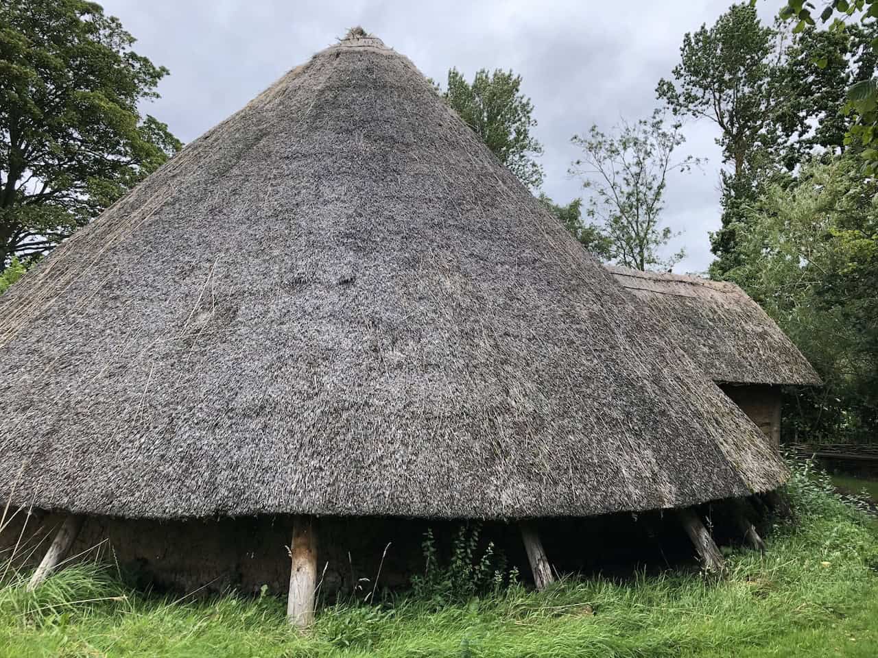 The Iron Age Roundhouse at Ryedale Folk Museum, an authentic reconstruction based on archaeological postholes found in the Ryedale landscape, with a wooden frame, wattle and daub walls, and a massive thatched roof of reeds or straw.