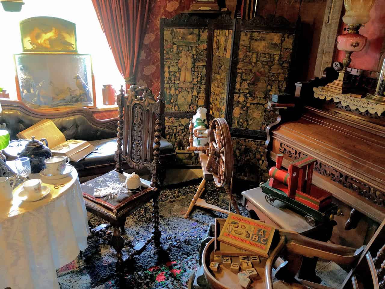 The cruck-frame structure of White Cottage, showing the large naturally curved oak beams that were split in half to form the characteristic A-frame of this medieval building technique, still visible in this Victorian-era cottage from Harome.
