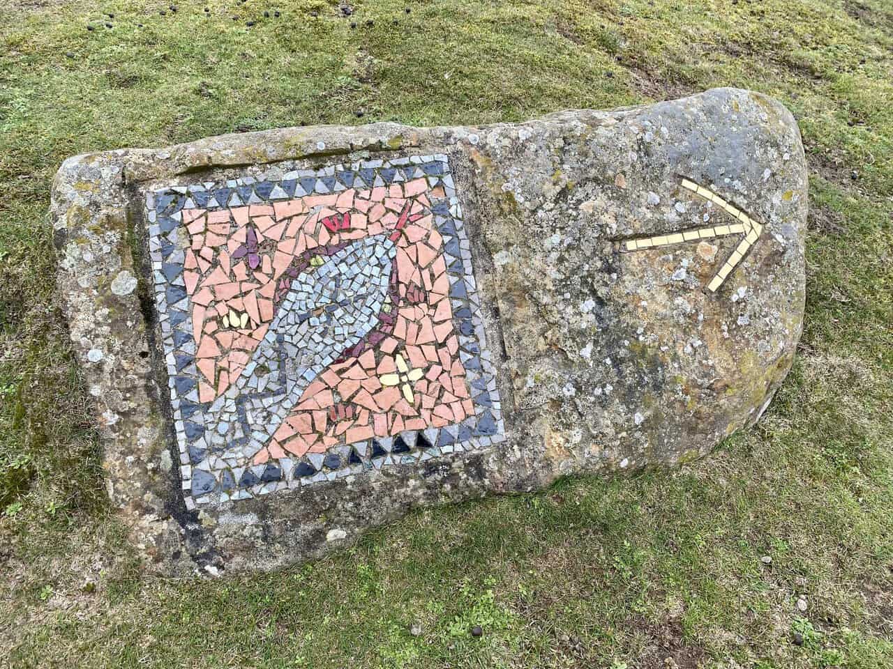 The Adder mosaic appears near a dry stone wall on the Crackpots Mosaic Walk.