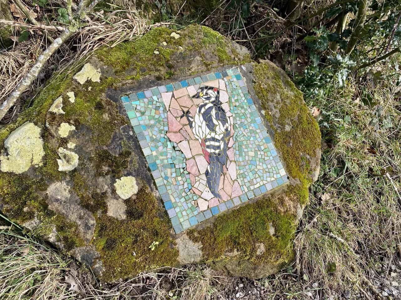 The Great Spotted Woodpecker mosaic stands beside the Ripon Rowel Walk.