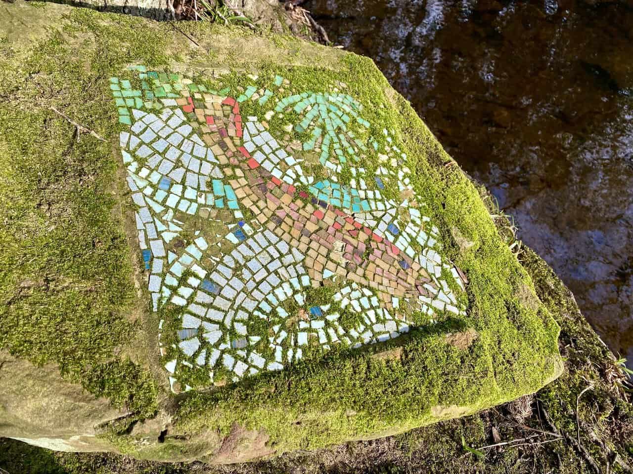 The Brown Trout mosaic appears after crossing a stream and heading uphill.