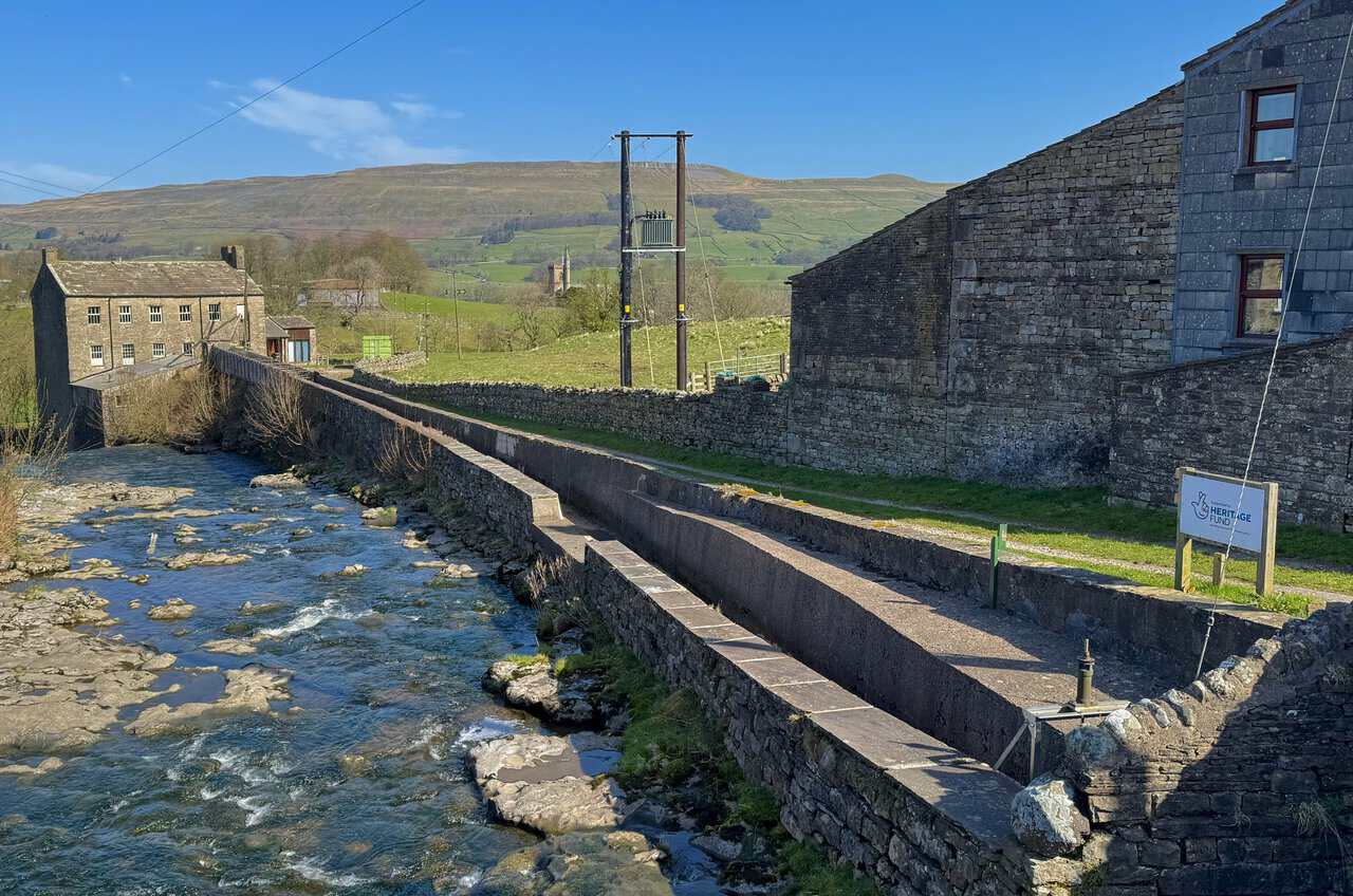 Gayle Beck flowing past the old mill in Gayle, a characterful scene along the Hawes Mosaic Trail.
