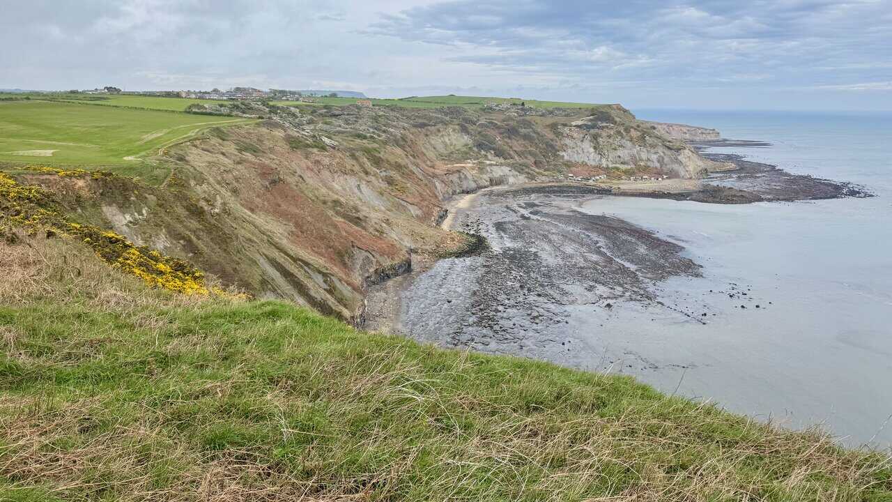 Clifftop views on the Runswick Bay circular walk looking along the rugged North Yorkshire coast.