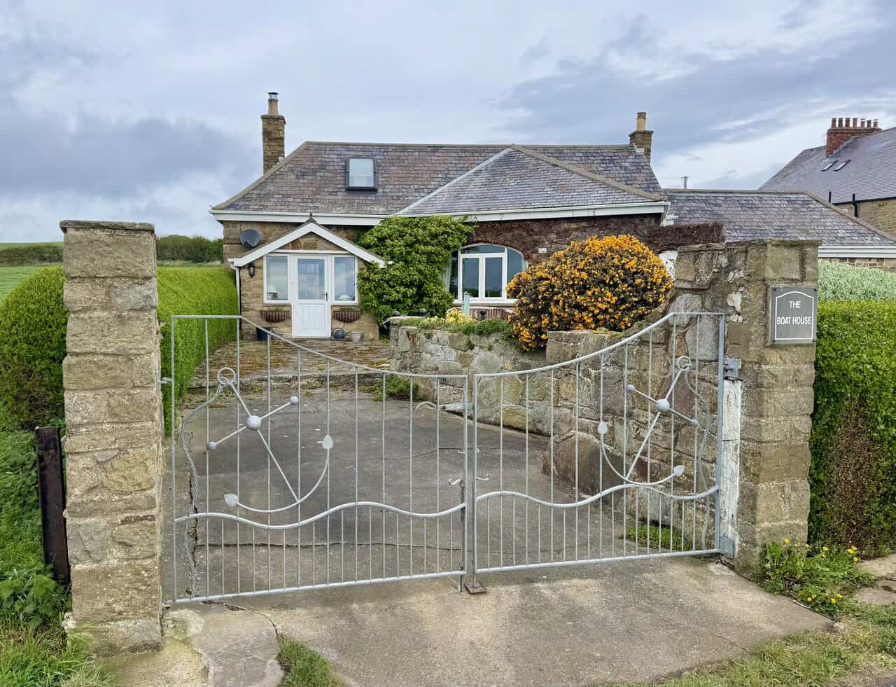 The Boat House stands beside the route near Port Mulgrave.