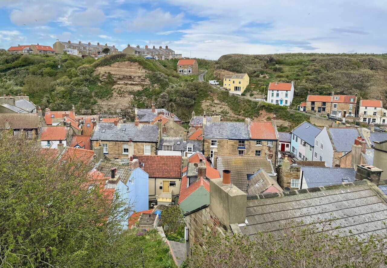 Red pantile roofs crowd together in Staithes on the Runswick Bay circular walk.