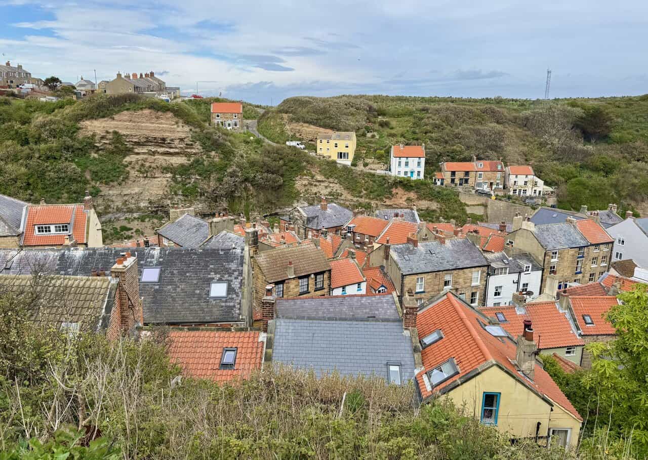 A high viewpoint on the Runswick Bay circular walk looks across Staithes towards the coast beyond.