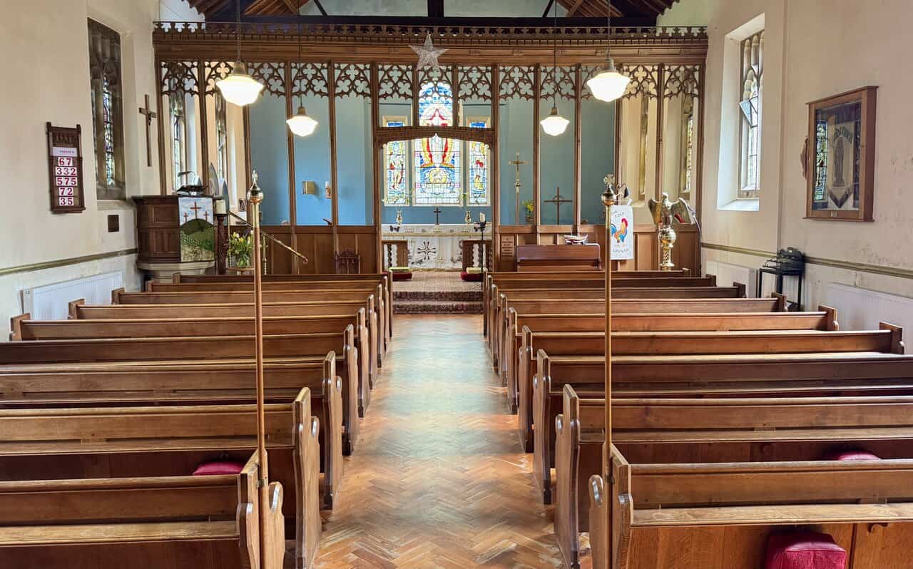 Soft light fills the church interior beyond the screen at St Hilda’s Church.