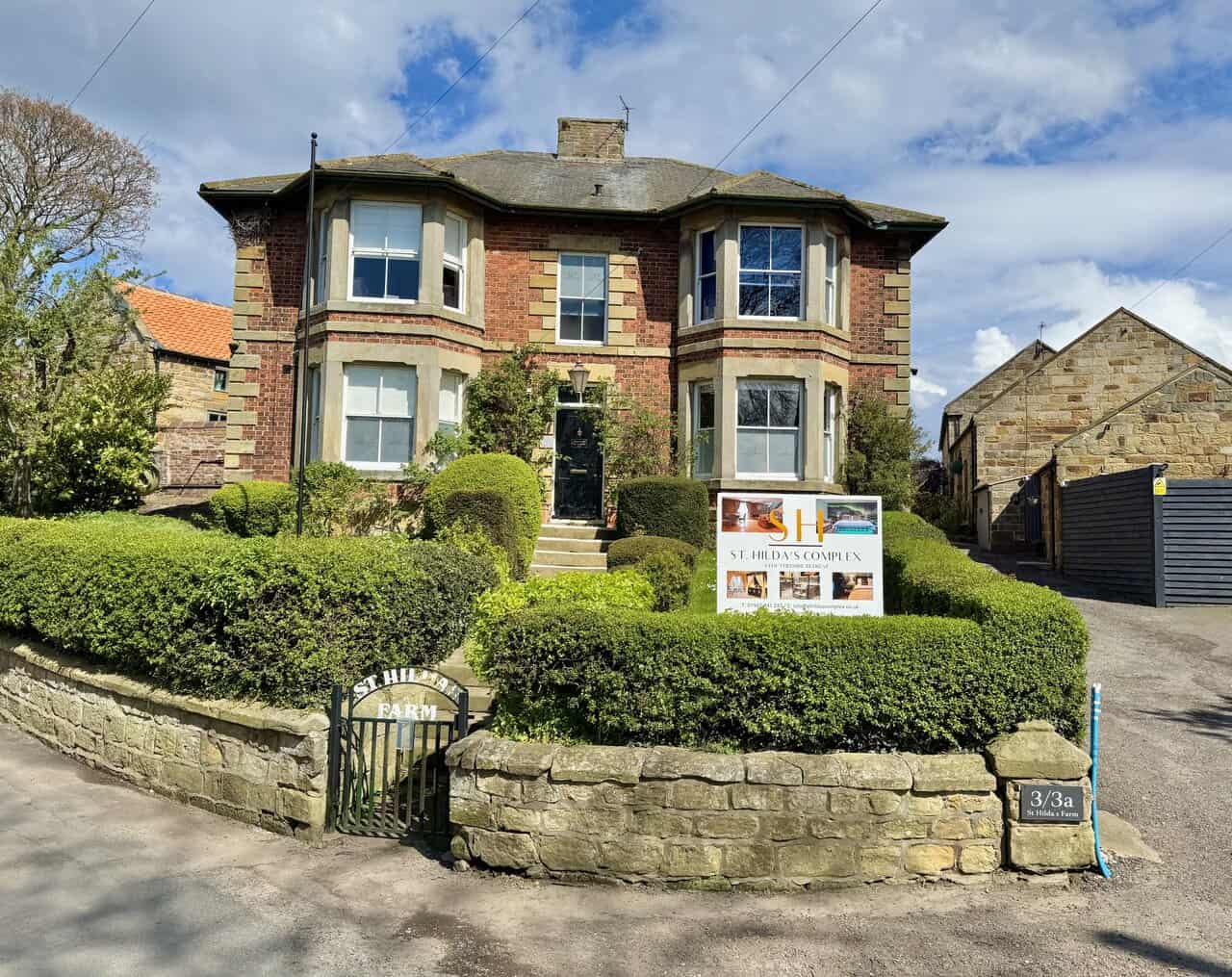 A farmhouse in Hinderwell, plus a complex of holiday cottages.