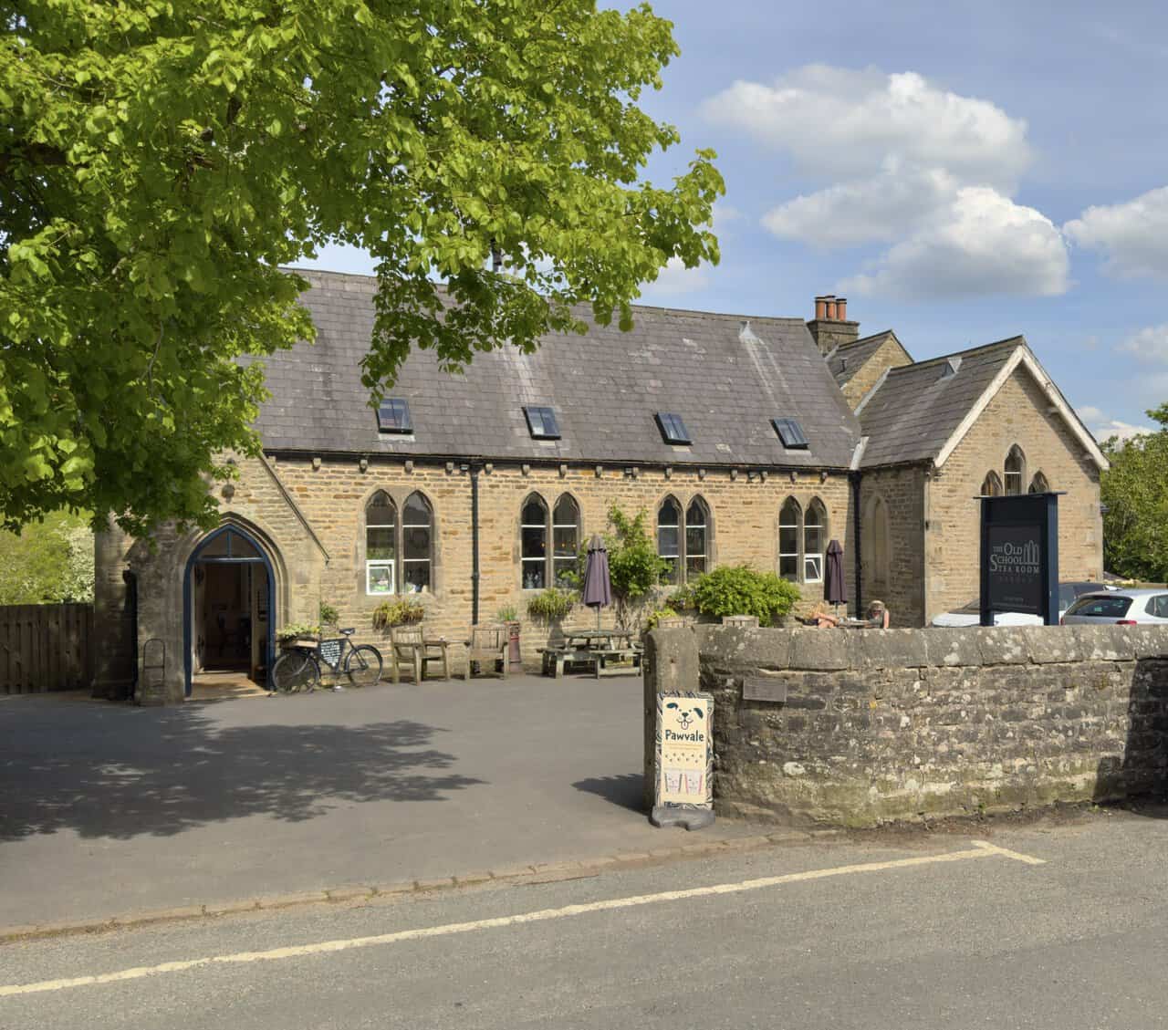 The Old School Tea Room in Hebden, set in the village's former schoolhouse with Gothic-arched windows, marking the end of the Hebden walk.