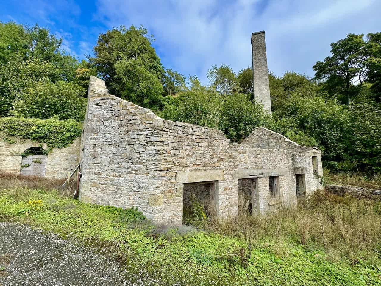 The remains of the Keldheads Lane lead smelt mill near Tullis Cote, a key feature on one of the Leyburn Shawl walks, showing the surviving stone structures from the mid-19th century mine.