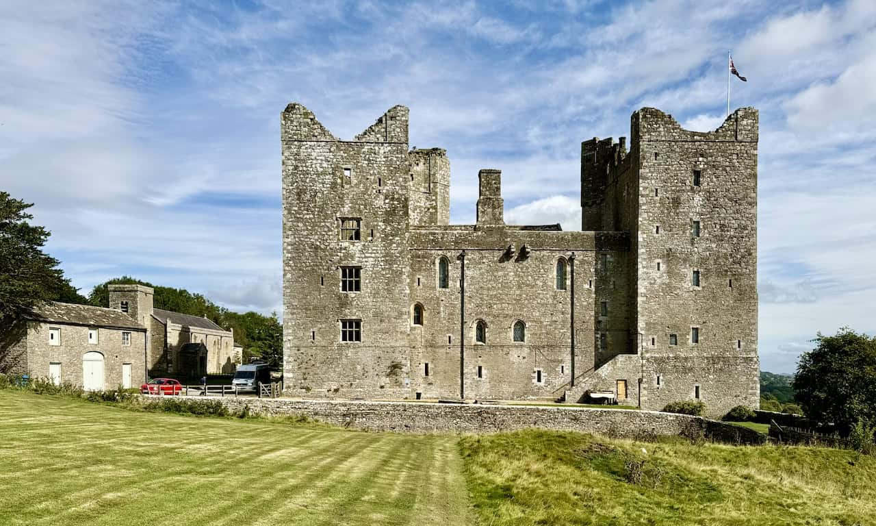 Bolton Castle is a well-preserved 14th-century fortress and a Grade I listed building, forming the centrepiece of the longer of the two walks.