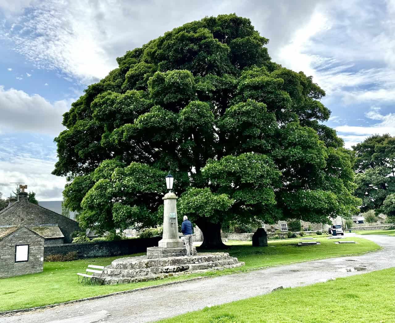 The striking stone monument on Redmire village green features three plaques commemorating Queen Victoria's Golden Jubilee, Queen Elizabeth II's Silver Jubilee, and her Platinum Jubilee.