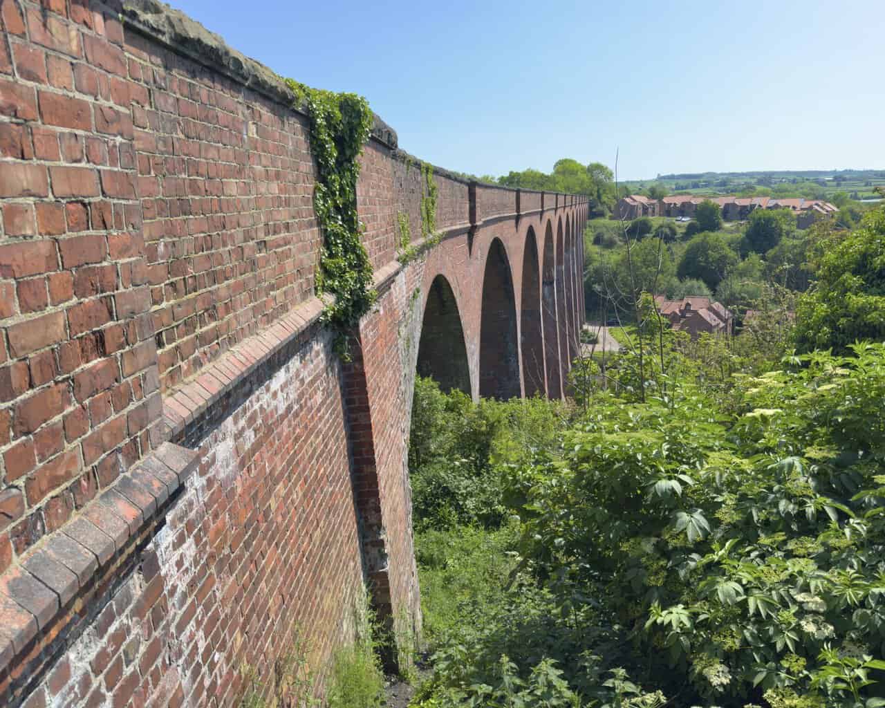 Larpool Viaduct carries the Cinder Track high above the River Esk, with its thirteen brick arches spanning the valley.