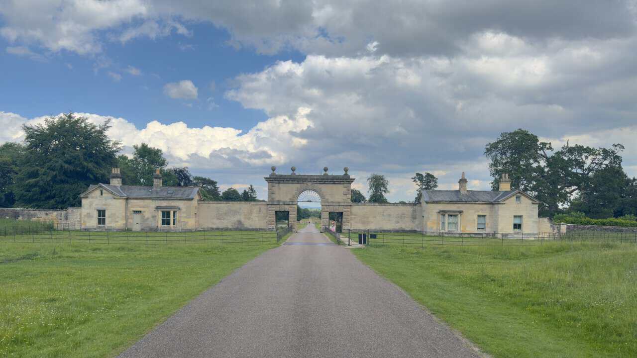 Studley Great Gate at the eastern edge of the deer park, with a classical archway and flanking stone lodges.
