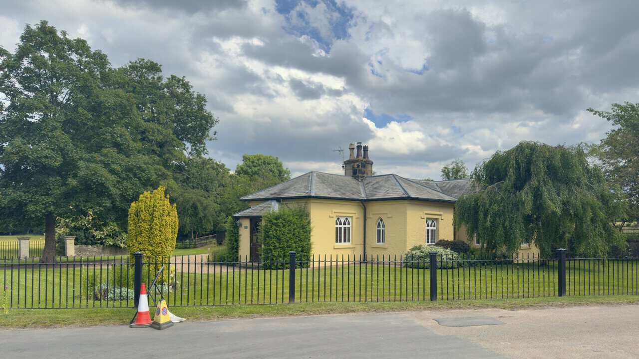 Studley Lodge on Plumpton Lane during a Ripon walk, a Grade II listed Gothick cottage with pointed windows and iron railings.