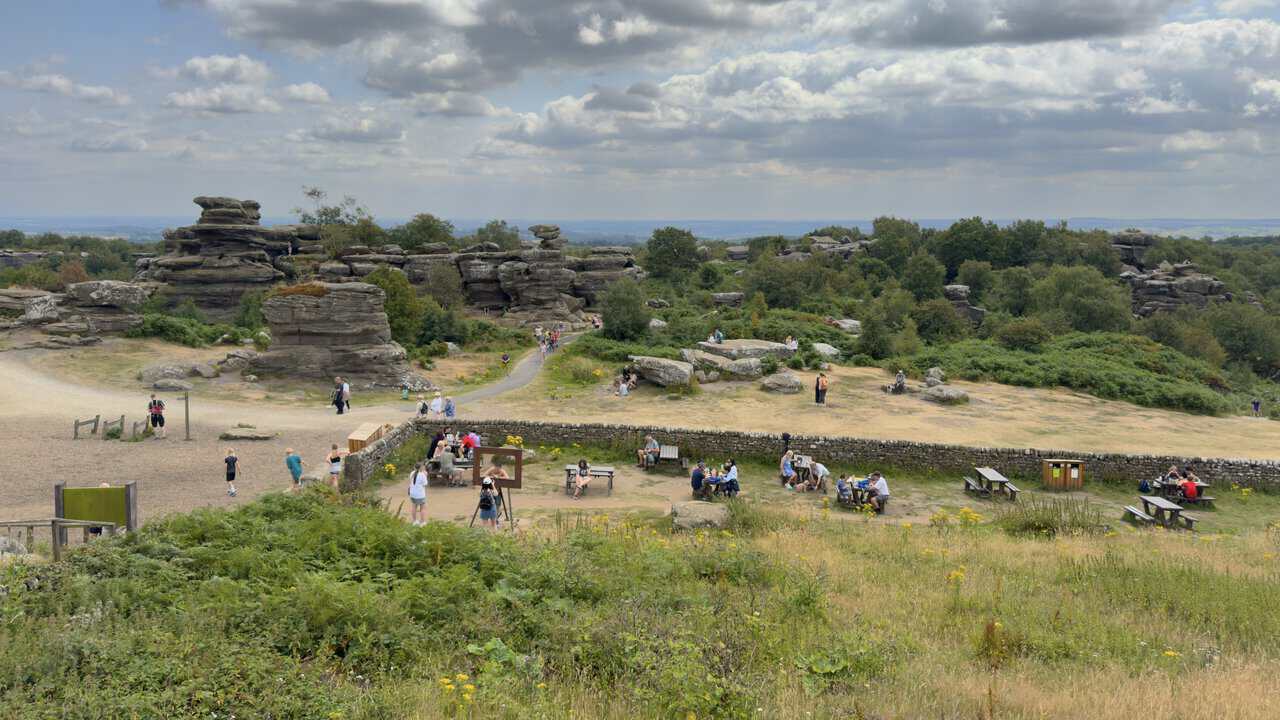 Weathered rock formations, balanced boulders and heather across the Brimham Rocks walk.