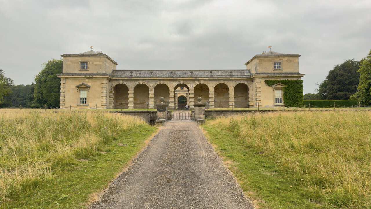 Studley Royal House, an imposing Palladian building of honey-coloured stone with two linked pavilion towers.
