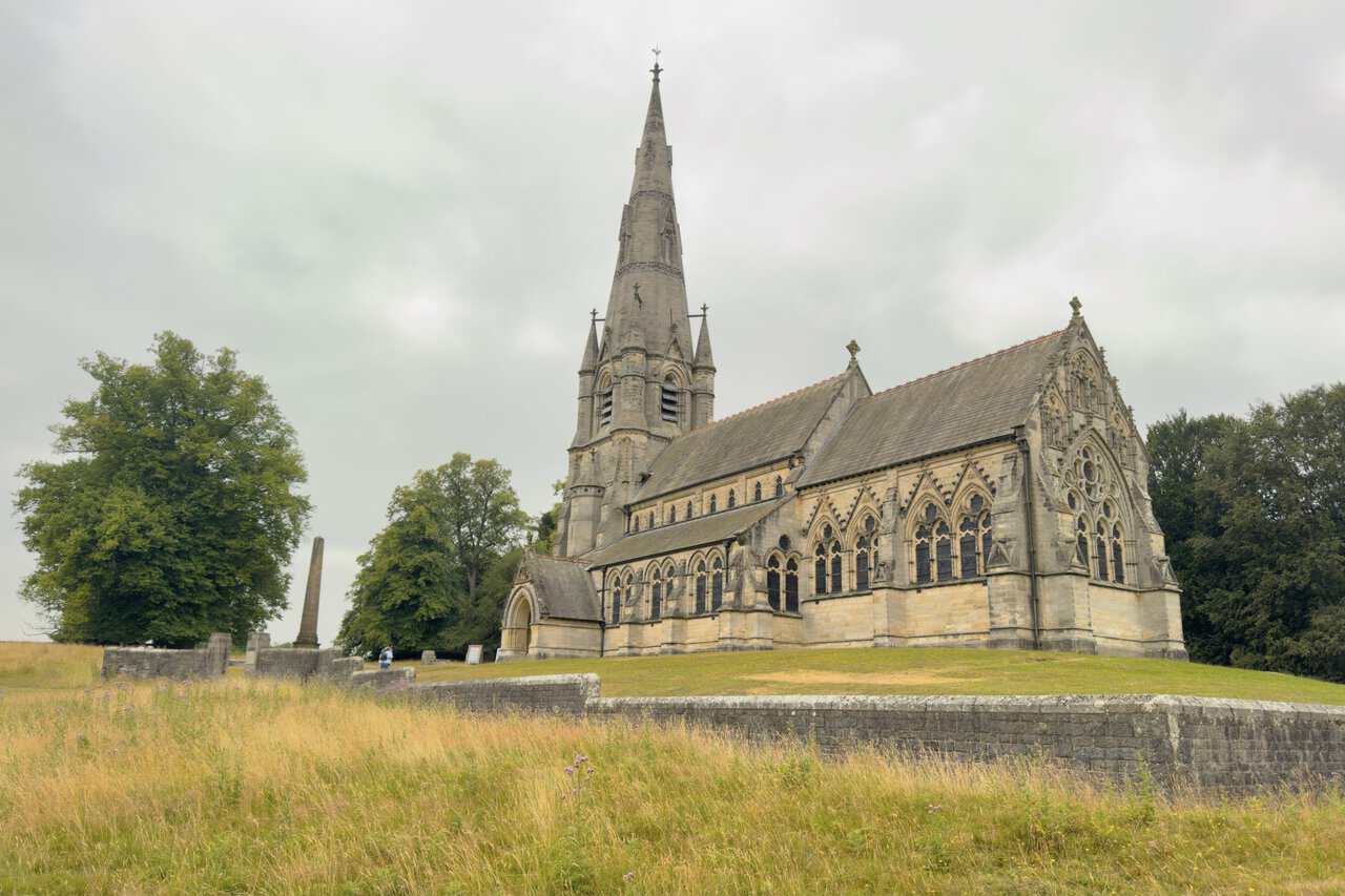 St Mary's Church, built as a memorial to Frederick Grantham Vyner, its tall spire a landmark across the deer park.