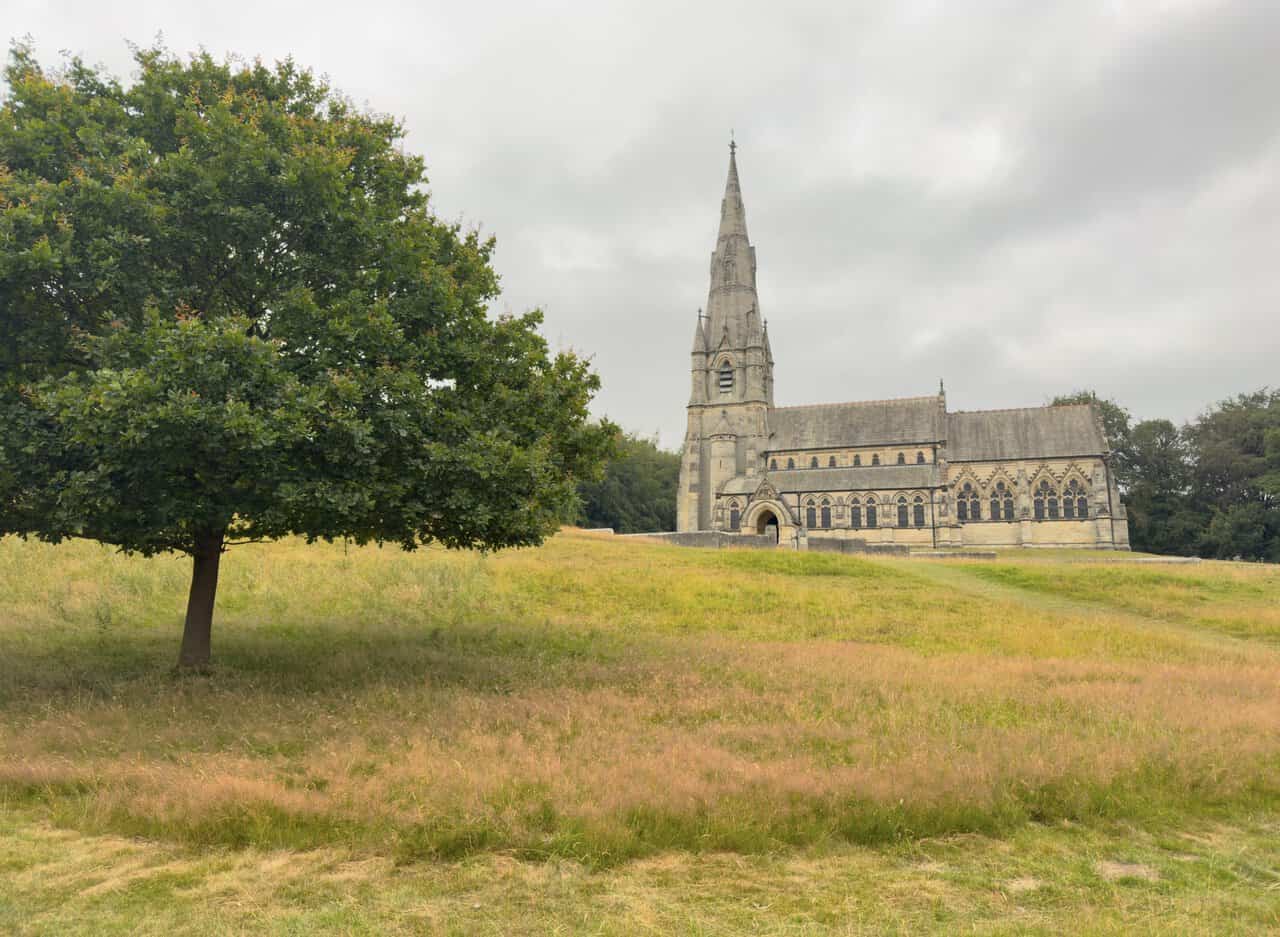 The soaring spire of St Mary's Church, William Burges's masterpiece, rising like that of a small cathedral.
