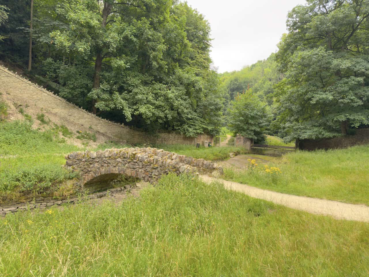 The fifth and last surviving stone bridge, near the gates leading out of the deer park on the Fountains Abbey walk.