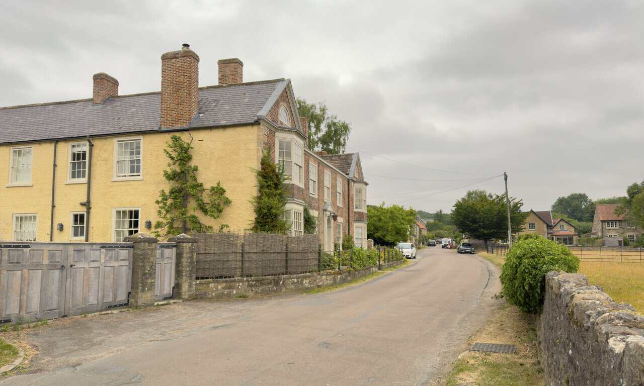 Lawrence House in the village of Studley Roger, with its pedimented gable and semicircular lunette window.