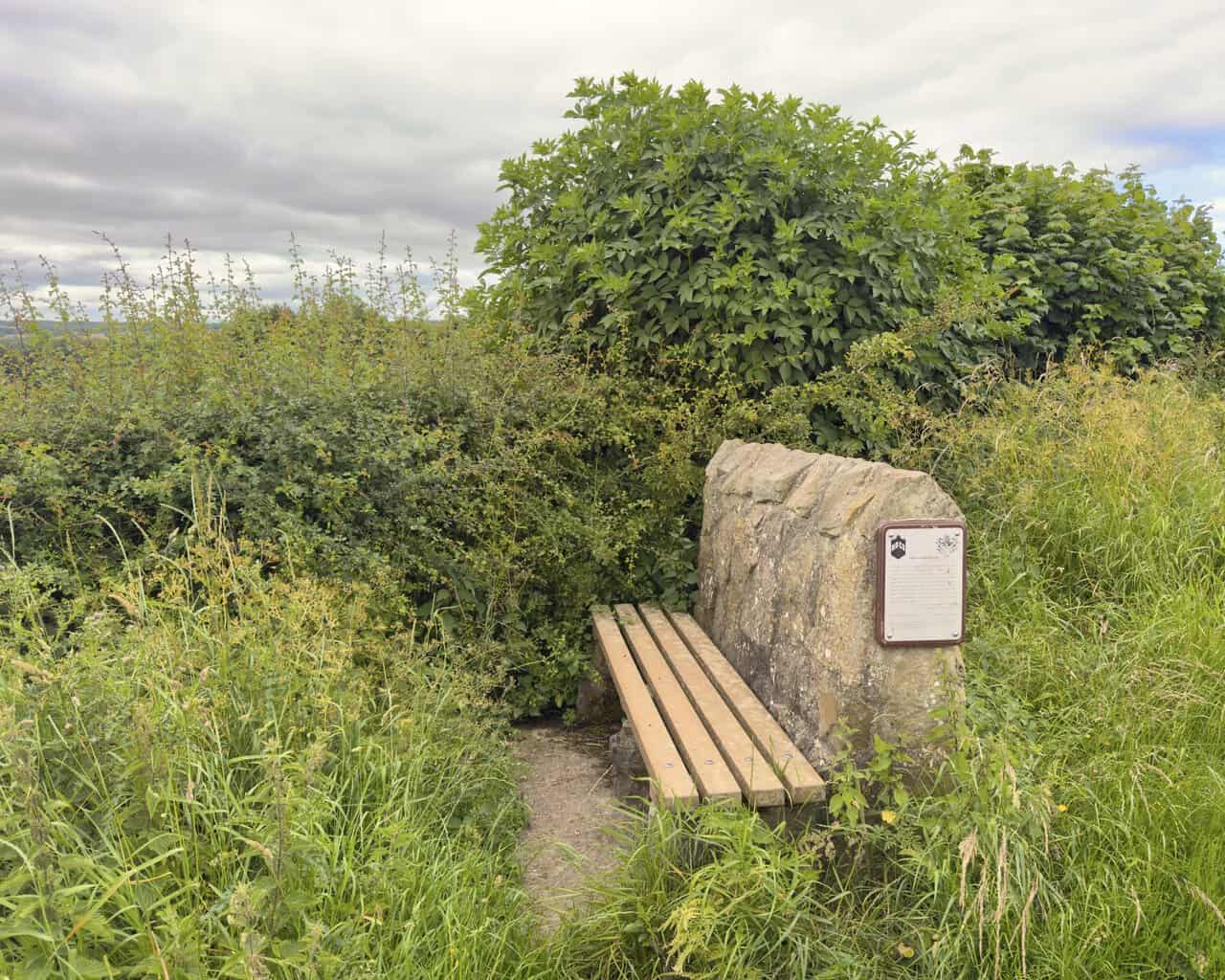 Stone Millennium bench on Westfields with an Alfred Wainwright plaque about the view towards Richmond.