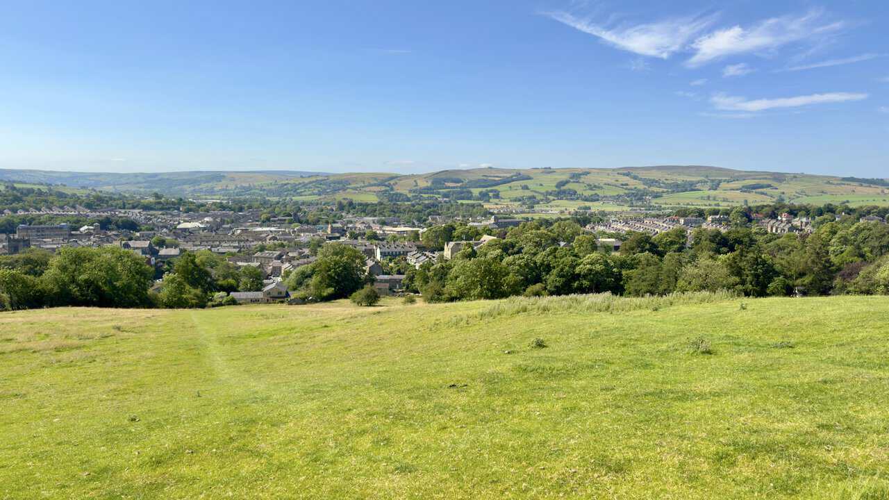 View from Park Hill over Skipton rooftops early in the Skipton walk, with moorland edges beyond.