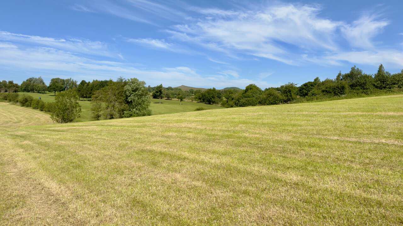 Mown fairways of Skipton Golf Club with Sharp Haw and Rough Haw on the skyline to the north-west.