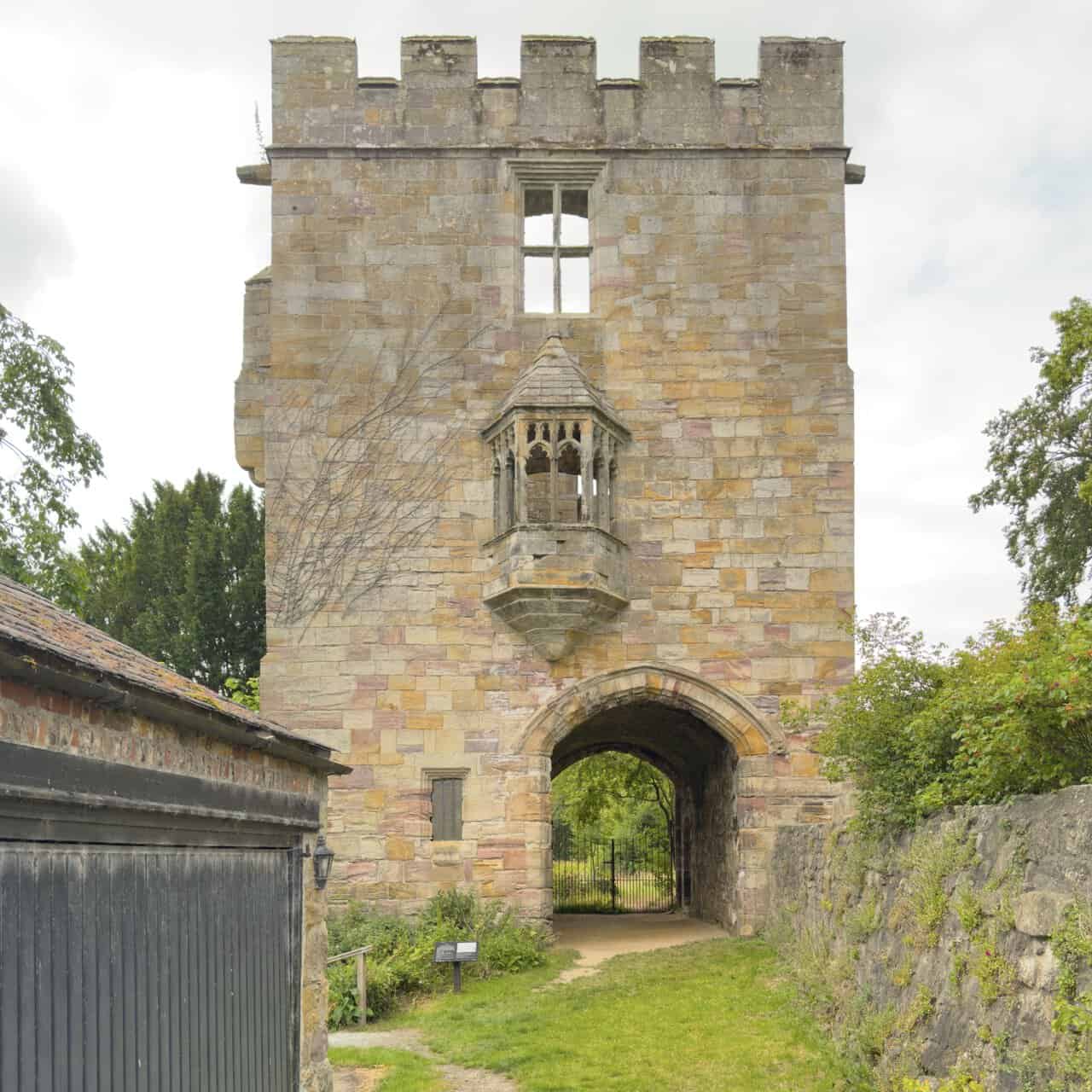 Three-storey Marmion Tower, a historic highlight of the West Tanfield walk, with battlements and an ornate oriel window.
