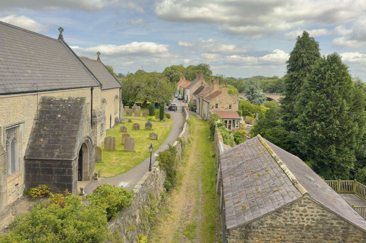 Final view on the West Tanfield walk from Marmion Tower across St Nicholas’s Church, Tanfield Bridge and the River Ure.