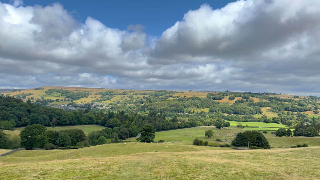 Wide view over the wooded valley of the River Nidd on the Yorke's Folly walk, with fields and moorland beyond.