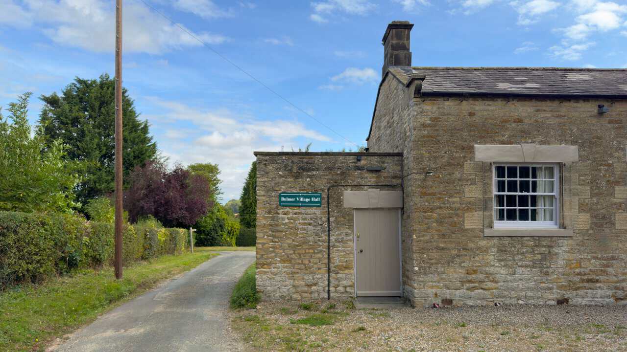 Bulmer Village Hall, a former village school built of limestone with a slate roof.