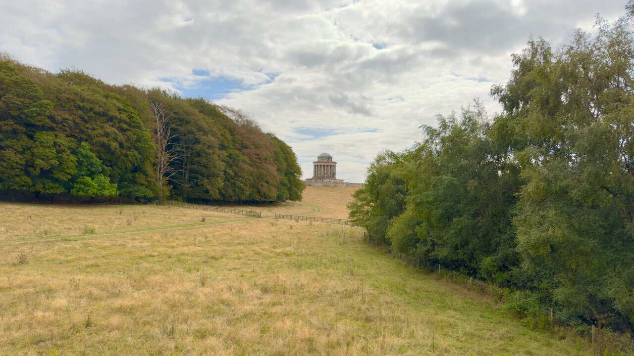 The Mausoleum on Kirk Hill framed by woodland on the Castle Howard estate.