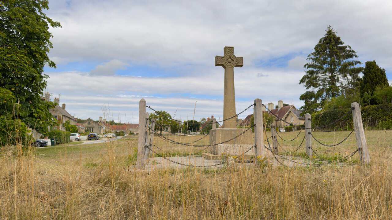 Celtic cross war memorial on the village green at Coneysthorpe.