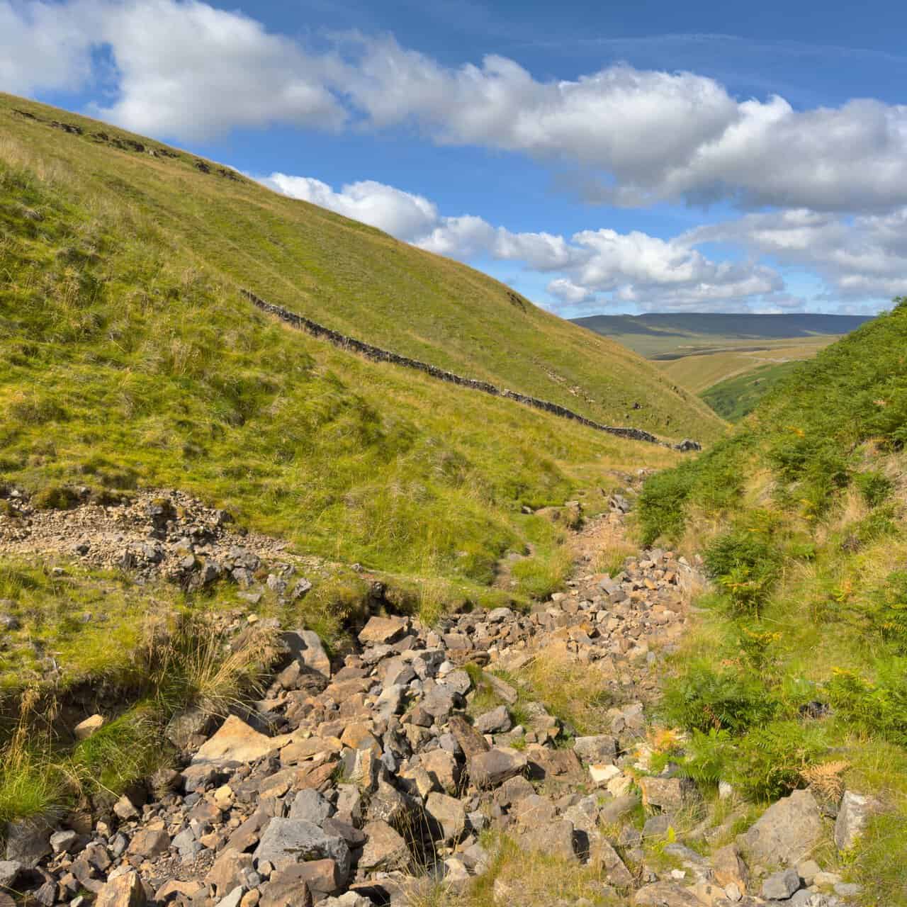 Looking back down the valley from Providence Pot, where the bed of the beck is a jumble of dry stones.