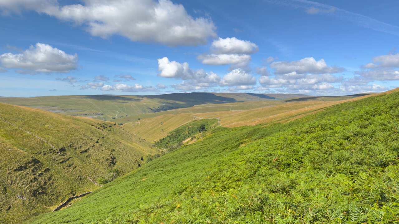 Wide views back down the Dowber Gill Beck valley from the steep path on the Great Whernside walk.