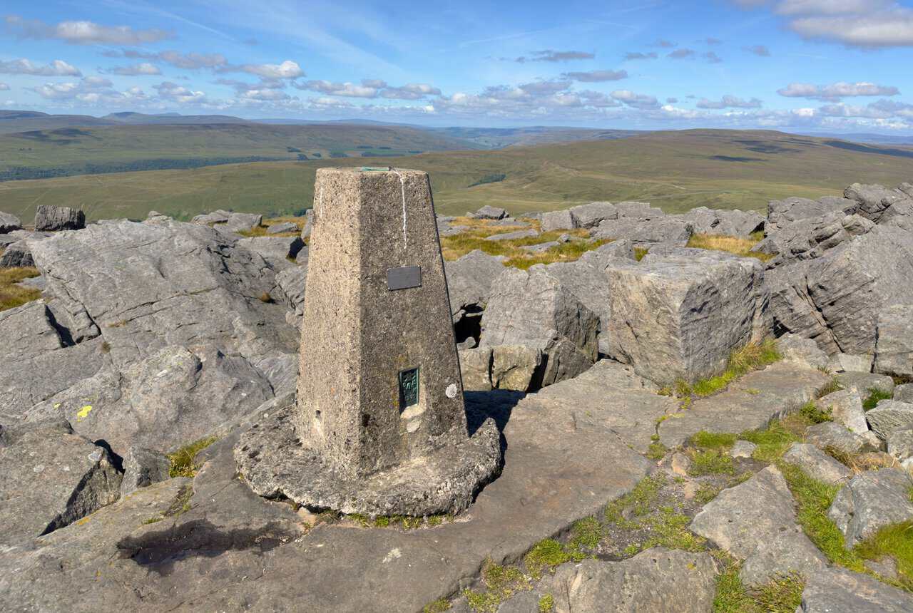 The triangulation pillar at 704 metres marking the high point of the Great Whernside walk.