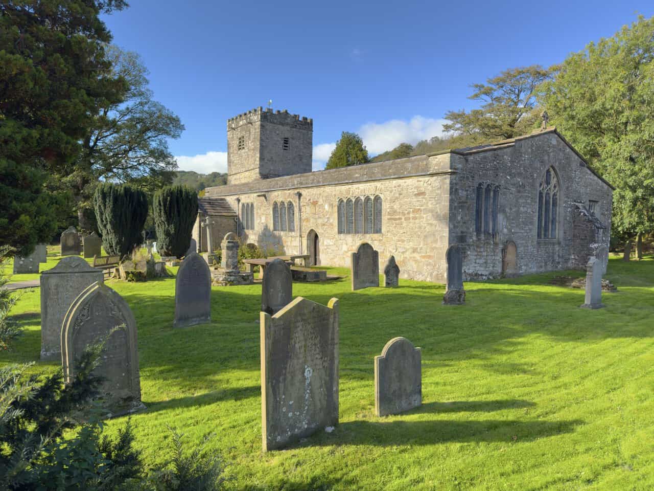 St Michael and All Angels Church at Hubberholme, with its battlemented tower and peaceful churchyard.