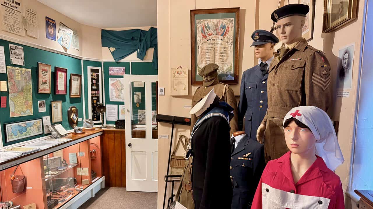 Uniforms from both World Wars, a Red Cross nurse figure and the Thornthwaite Roll of Honour in the World Wars Room.