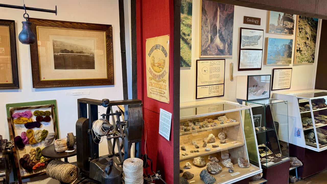 The geology section at Nidderdale Museum, with a twine-making machine, a Dale Twine Works photograph and cases of local rocks and minerals.